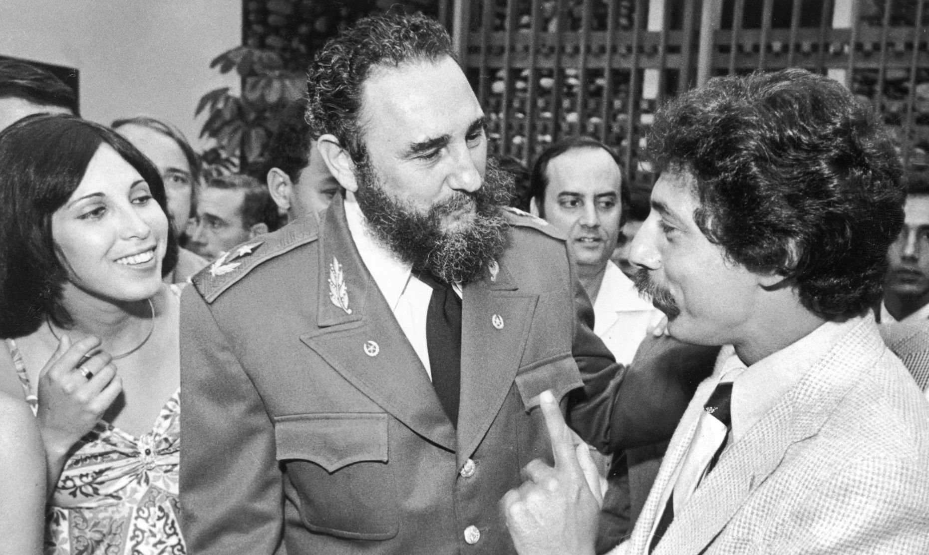 1975, '77, '78: Visits Cuba, gives key to city to Fidel Castro